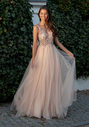 Evening dress made of tulle with rhinestones in champagne